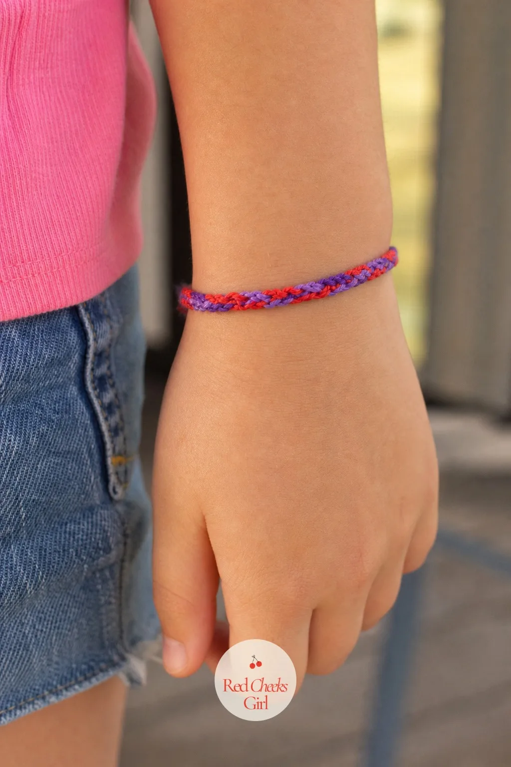 Friendship Bracelet Kit: Friendship Bracelet, Knot Just Candy — Coils of embroidery floss in red and purple, wound around small cardboard bobbins and tucked