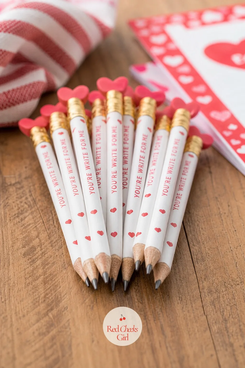 Heart-Top Pencils: You're Write for Me — A bundle of pencils topped with small red heart erasers fans out across a desk like a tiny bouquet, and every one of