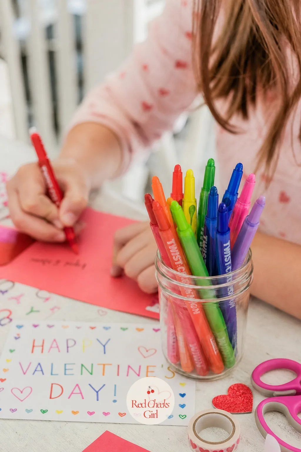 Mini Crayon Twist Set: Color My World, Valentine — A handful of twist up crayons, stood upright in a small glass jar, shows off the whole rainbow at once