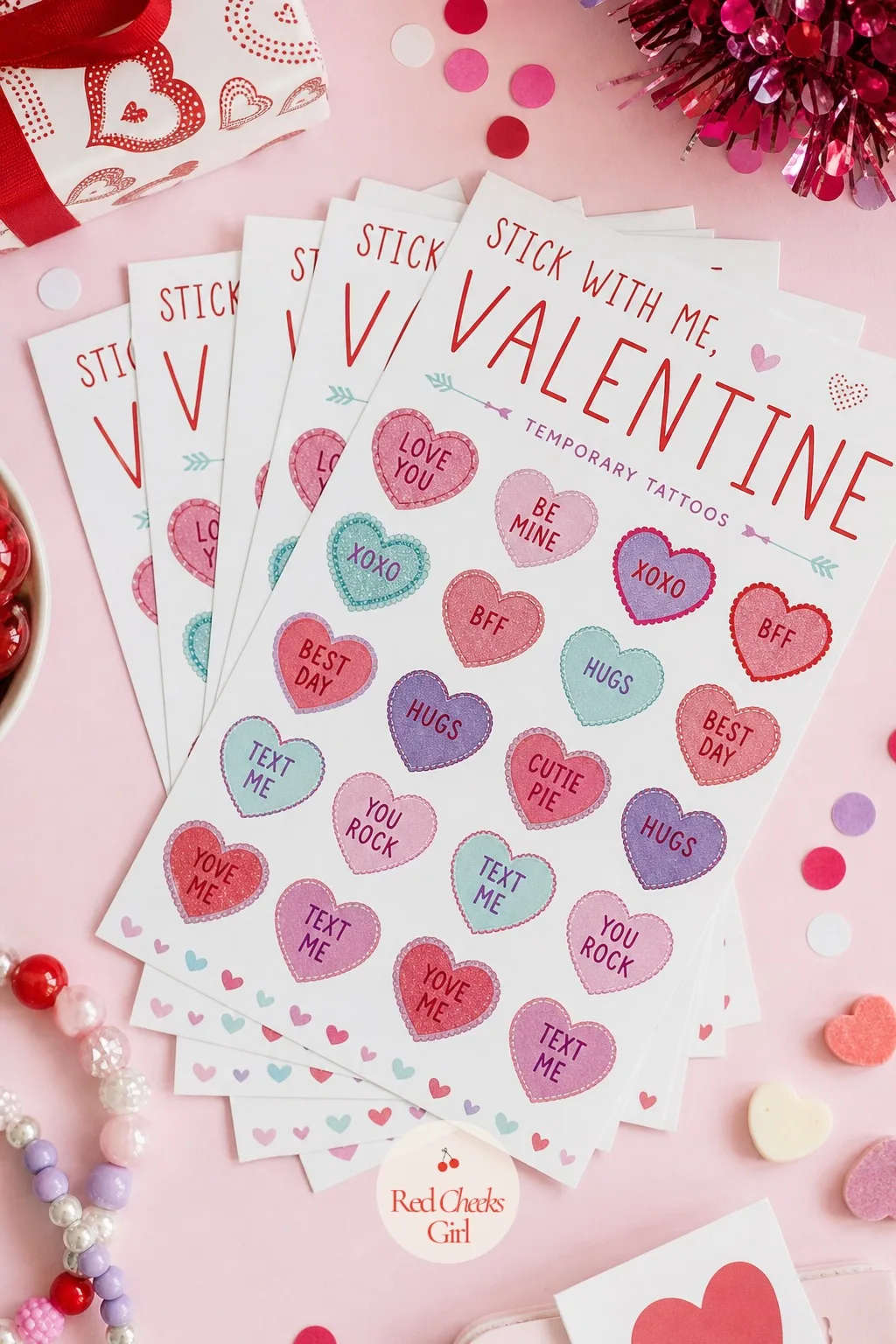 Temporary Tattoo Sheets: Stick With Me, Valentine — A sheet of small heart and star tattoos fanned out flat is flat enough to slip inside a regular envelope
