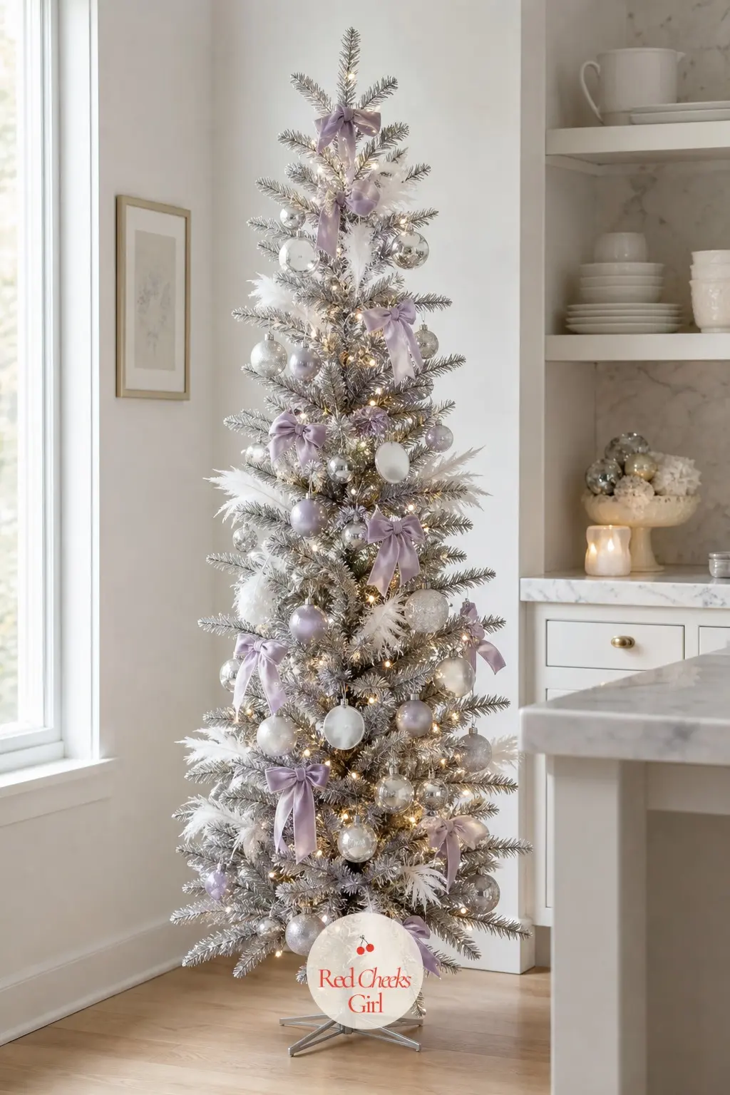 A Sparse Pewter Tree Dusted With Lavender Frost — An artificial tree in pewter tinsel rather than green or flocked white, left sparse and airy so the metallic