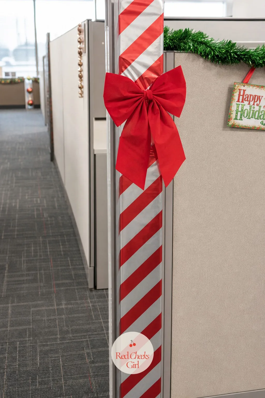 Entrance Wrapped Like a Gift — She will protest that there is nothing to wrap, no box, no door, just an opening in a fabric panel. Office christmas decorations