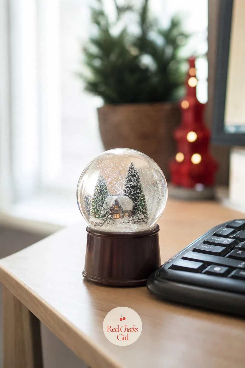 Snow Globe on the Desk Corner — Every desk has one corner that collects clutter instead of anything worth looking at, and a small snow globe claims it back in