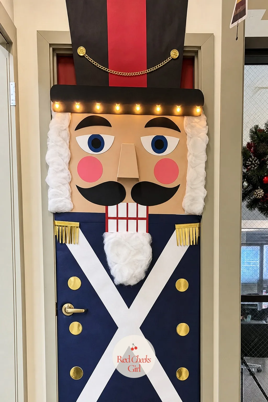 Nutcracker Soldier — A door that salutes you is hard to scroll past, and the nutcracker soldier plays on height rather than detail. Office door christmas
