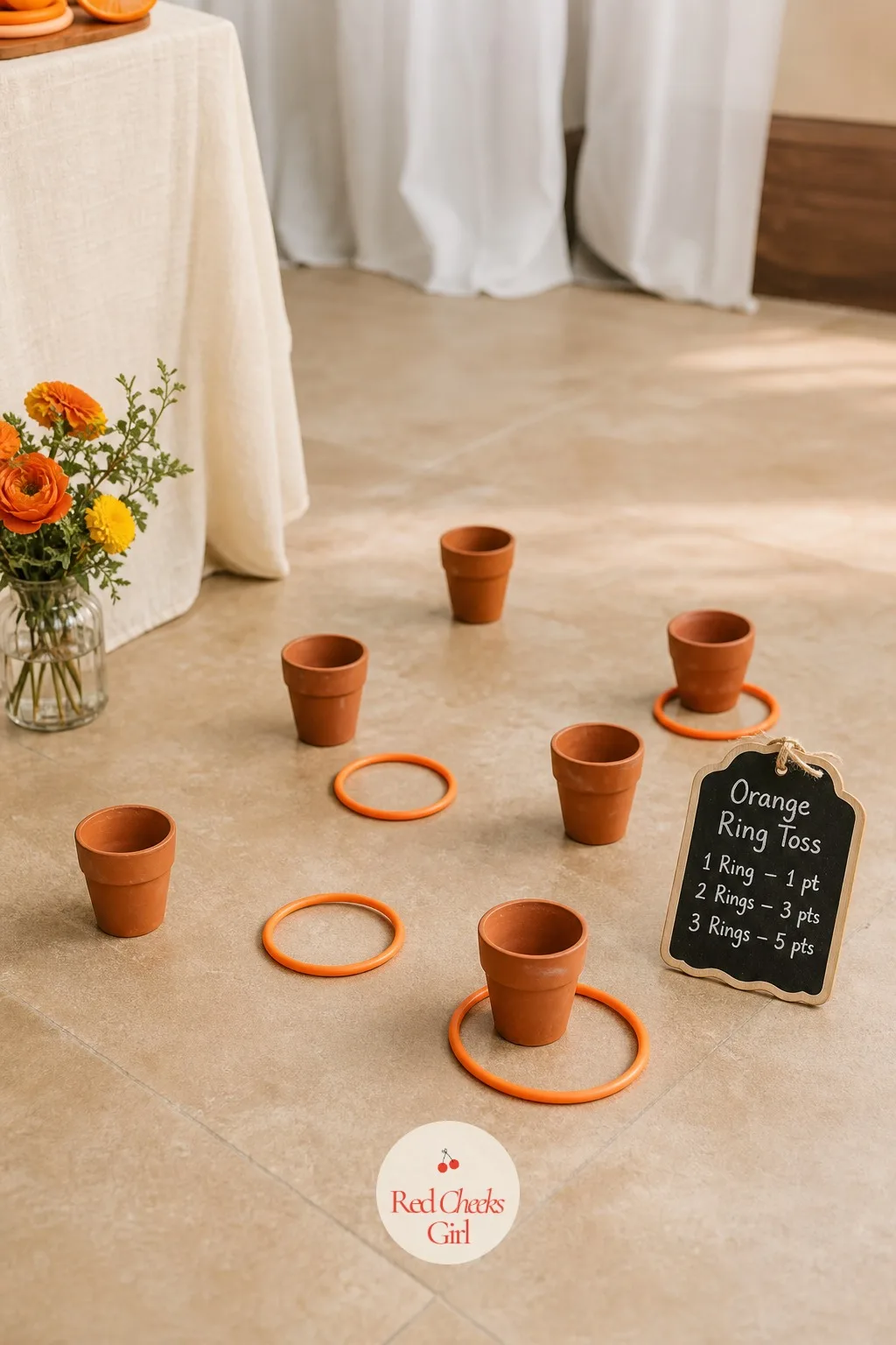 Orange Ring Toss — Set five or six small terracotta pots in a loose triangle on the floor or a low table, each one worth a different number of points written