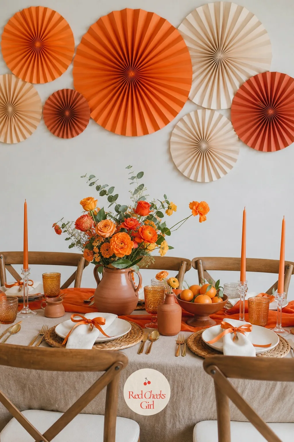 Tangerine Paper Fan Cluster — If fruit on a string is not her speed, or the venue will not allow anything hung near food, a cluster of paper fans fills the