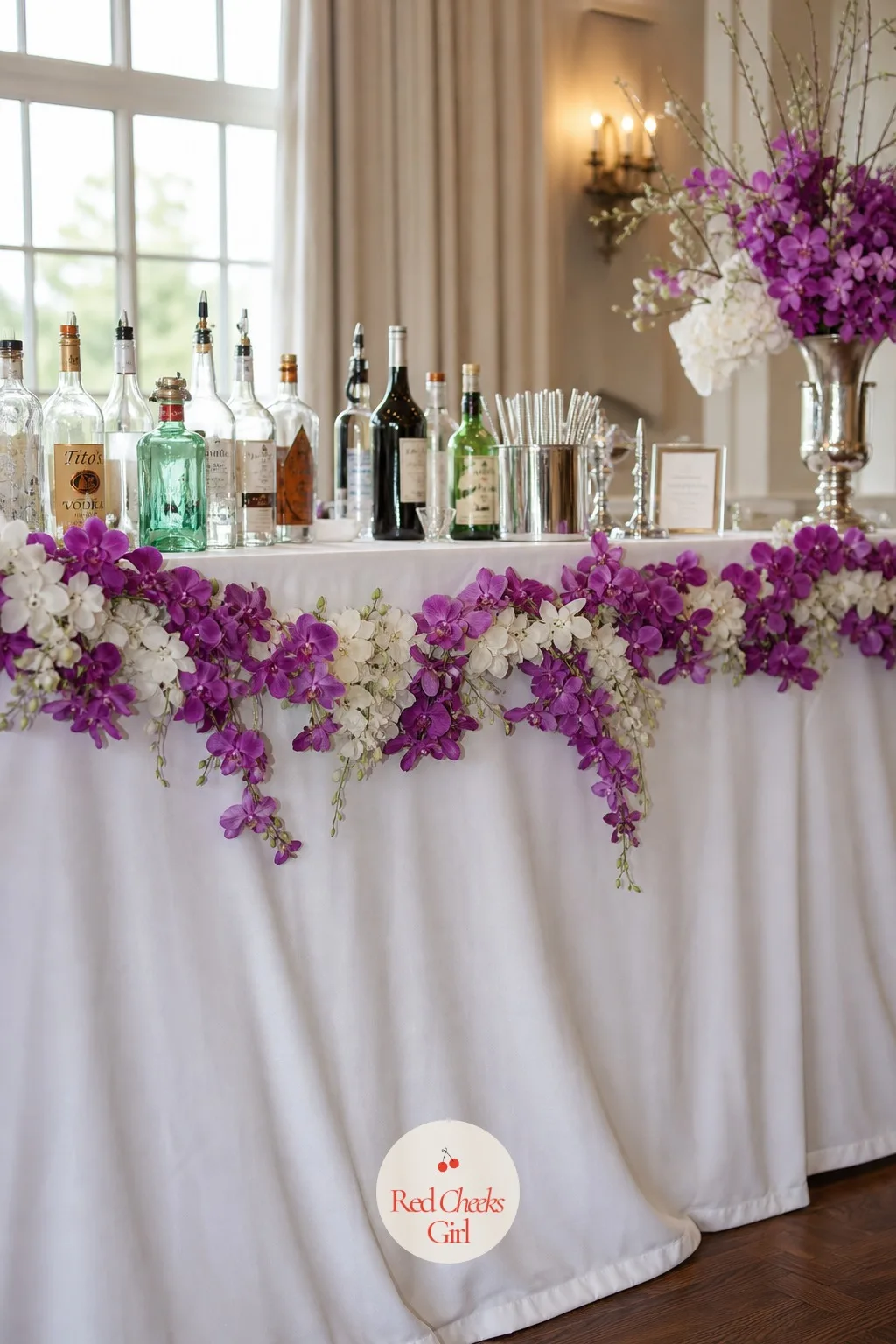 Bar Backdrop Styled with Violet Orchid Garlands — A bar that looks like a rented folding table undoes a whole room's worth of styling in one glance. Orchid