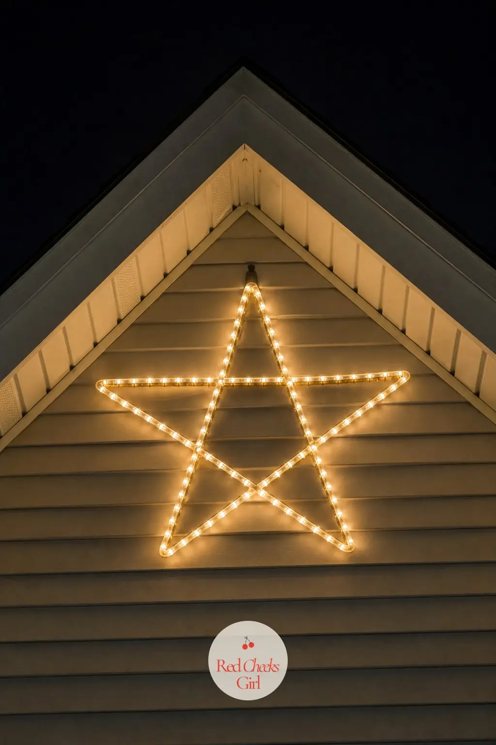 A Gable Peak Hung with a Single Oversized Lit Star — One large lit star, mounted at the peak of the gable, works as the single highest point of light on the