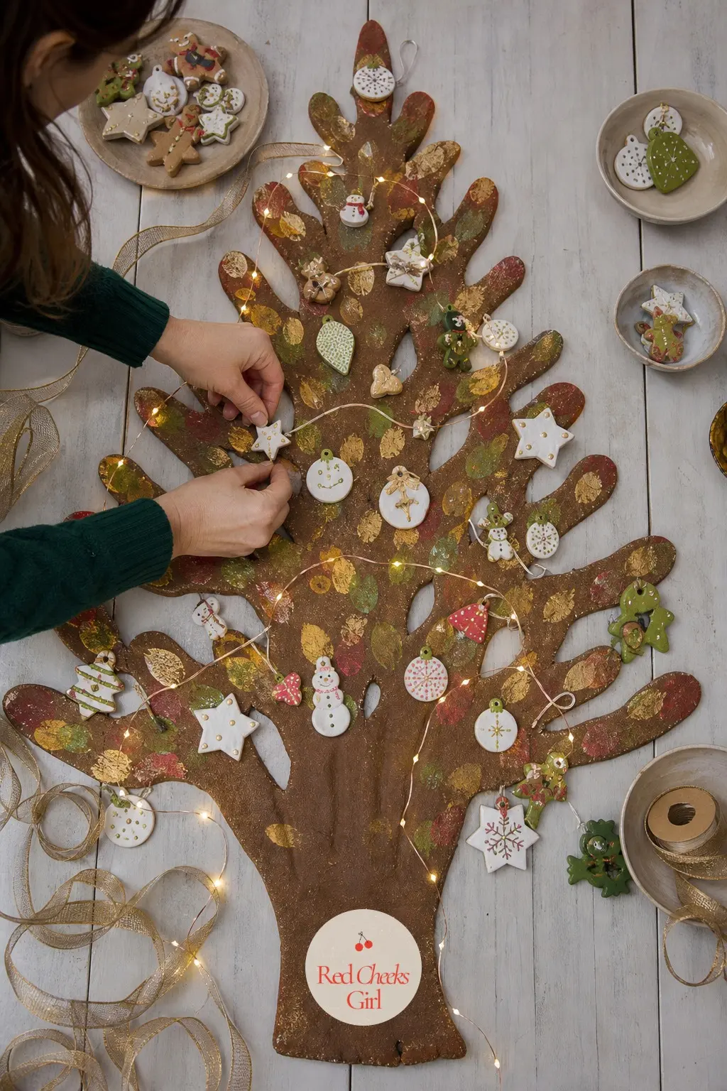 Family Handprint Tree — An adult palm pressed firmly becomes the trunk, and a handful of smaller fingertip prints dotted above it become the canopy: this is