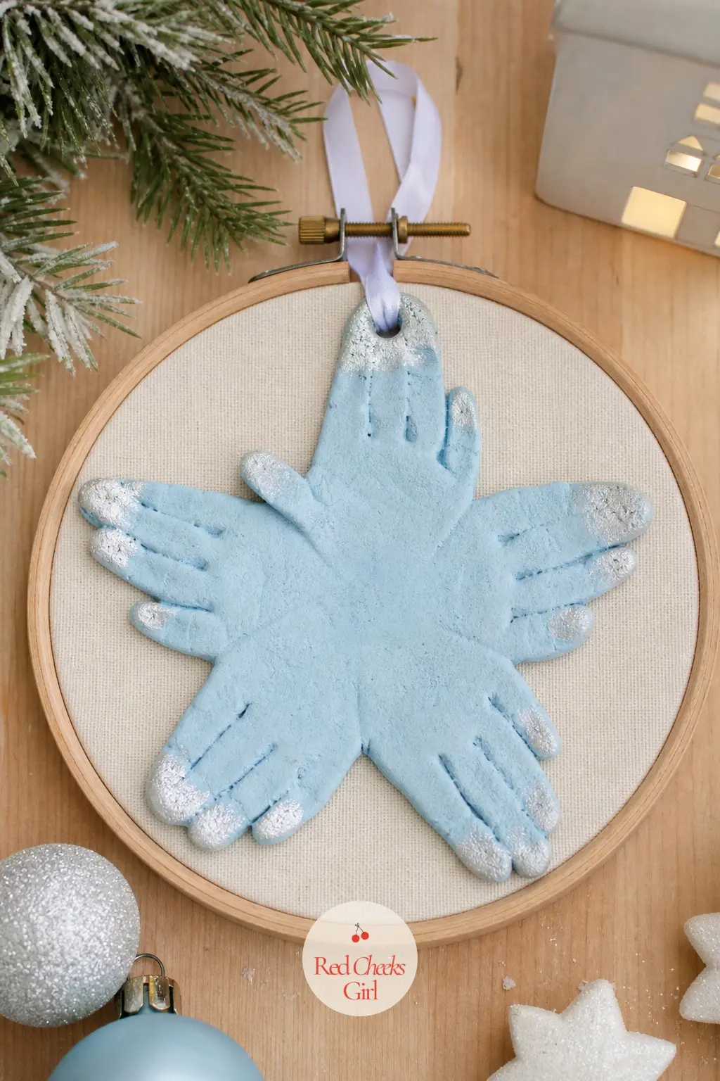 Framed Handprint Star — Spread the fingers wide before pressing, so each one becomes a point of a star radiating out from the palm. Painted salt dough ornaments
