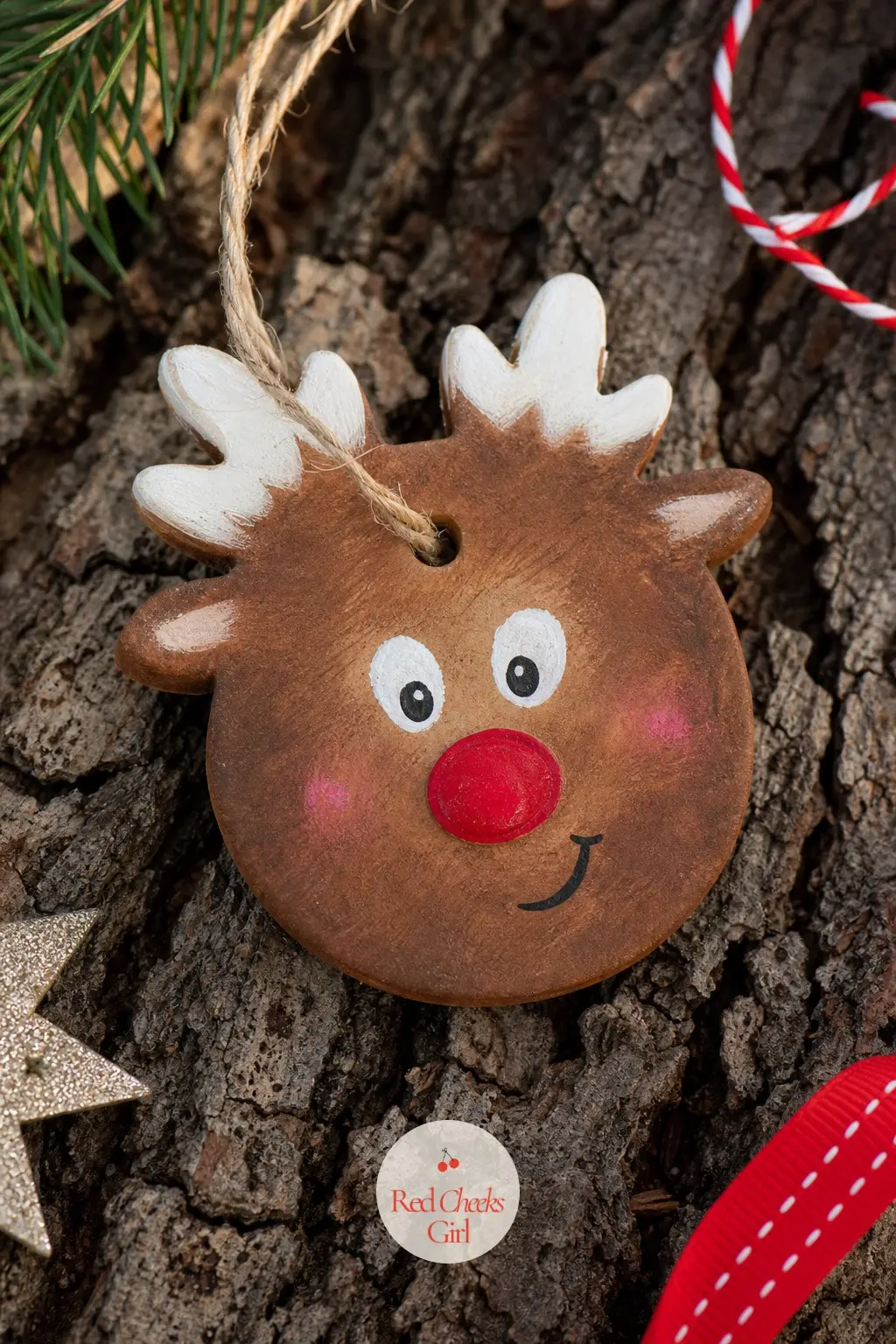 Reindeer Face Ornament — Warm chestnut brown replaces the white base here, with short flicked strokes in a slightly darker brown to suggest fur texture without