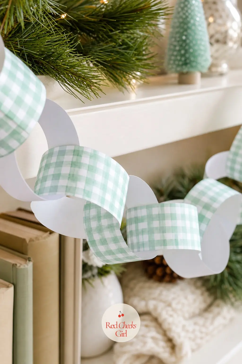 Mint Gingham Paper Chain — A strip chain in mint and white gingham, the check scale shifting slightly from strip to strip so the rings do not all look stamped