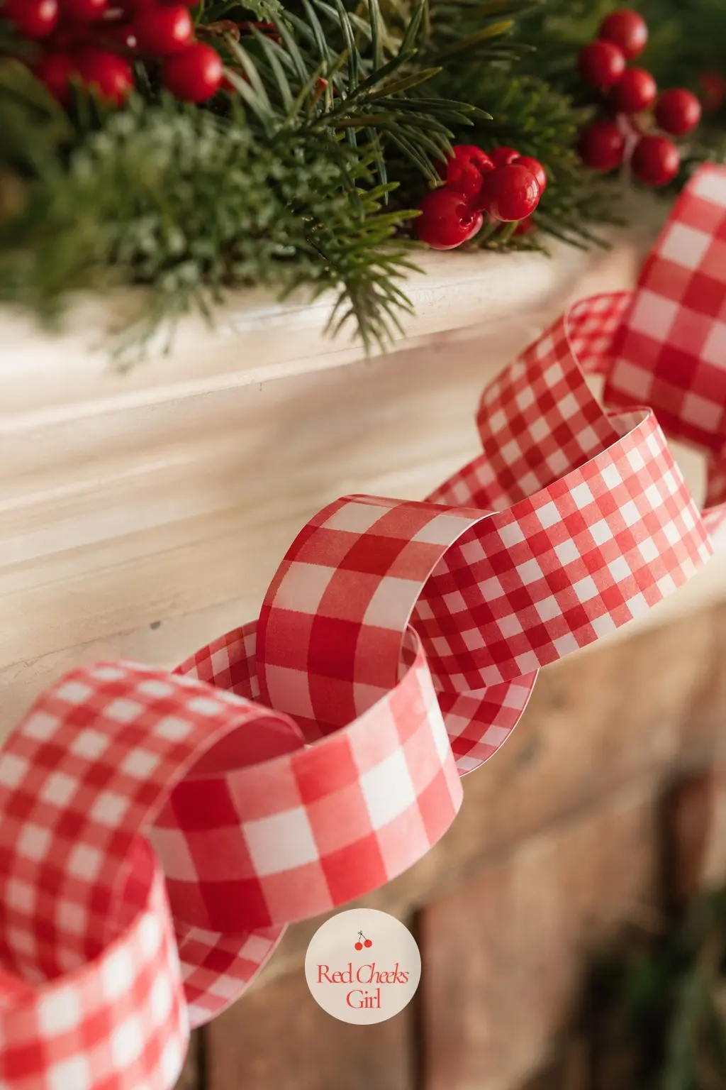 Red Gingham Paper Chain — The warmer cousin of the mint version: red and white gingham at a slightly larger check scale, which keeps the two from reading as