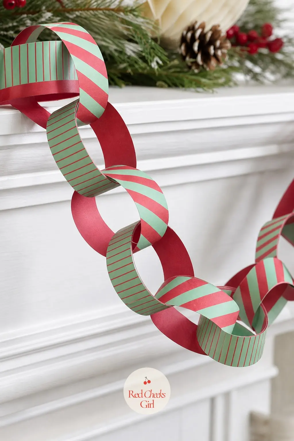 Red and Mint Candy Stripes Paper Chain — A strip paper chain in alternating candy stripe patterns, red and mint running diagonal on some strips and straight on