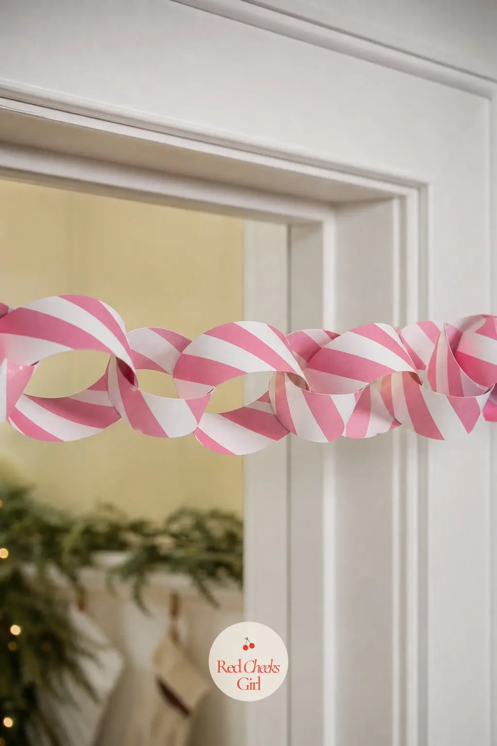Retro Ribbon Candy — Diagonal peppermint stripes in pink and white, the same twist you find on actual ribbon candy, fill every strip of this chain. Paper