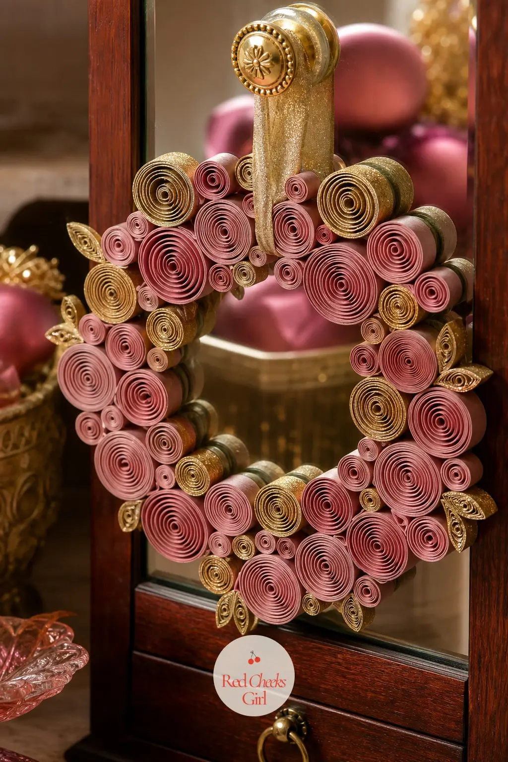 The Dusty Pink and Gold Quilled Paper Wreath for the Jewelry Armoire — Thin strips of dusty pink and gold paper get rolled into tight coils on a quilling tool