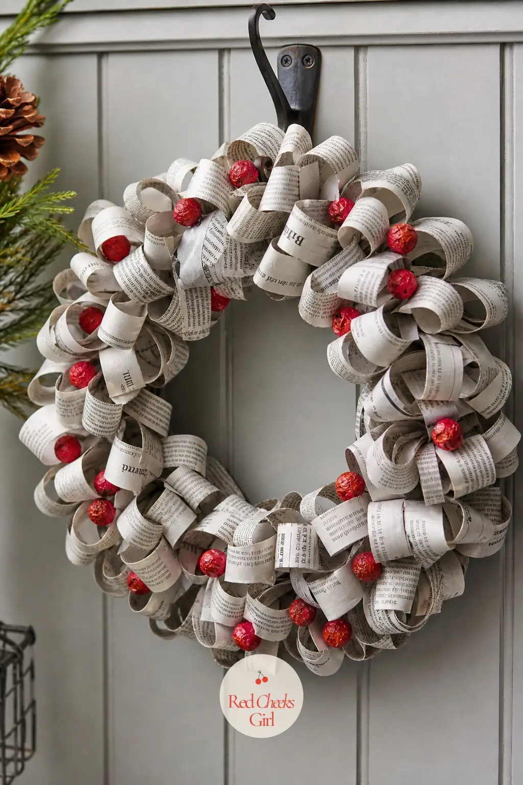 The Newsprint Grey and Red Classifieds Wreath for the Mudroom — Rolled strips of old newsprint, grey and slightly brittle at the edges, wrap a wreath form end