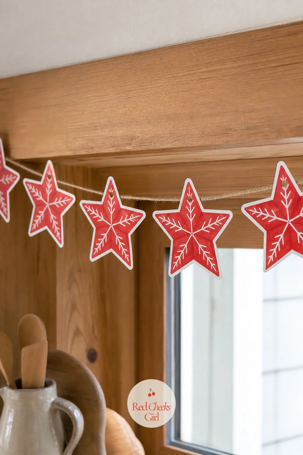 Scandinavian Red and White Stars — A red star with a thin white folk-art line running through the center of each point, the kind of pared-back pattern you see