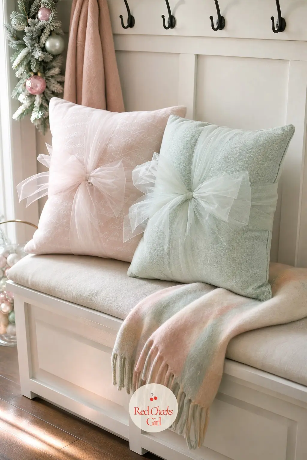 The Entry Bench, Lined with Tulle-Tied Cushions — Two cushions, each tied with a soft tulle knot rather than a bow, sit on the bench just inside the door, a