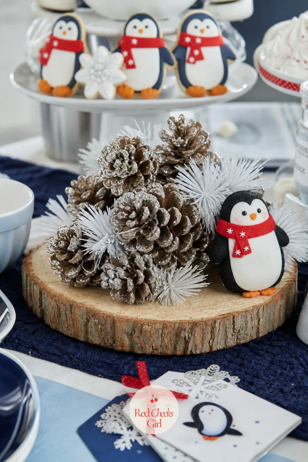 Birch and Pinecone Centerpiece — All that glossy white and navy needs one natural, grounded note or the table starts to feel too sweet. Penguin baby shower