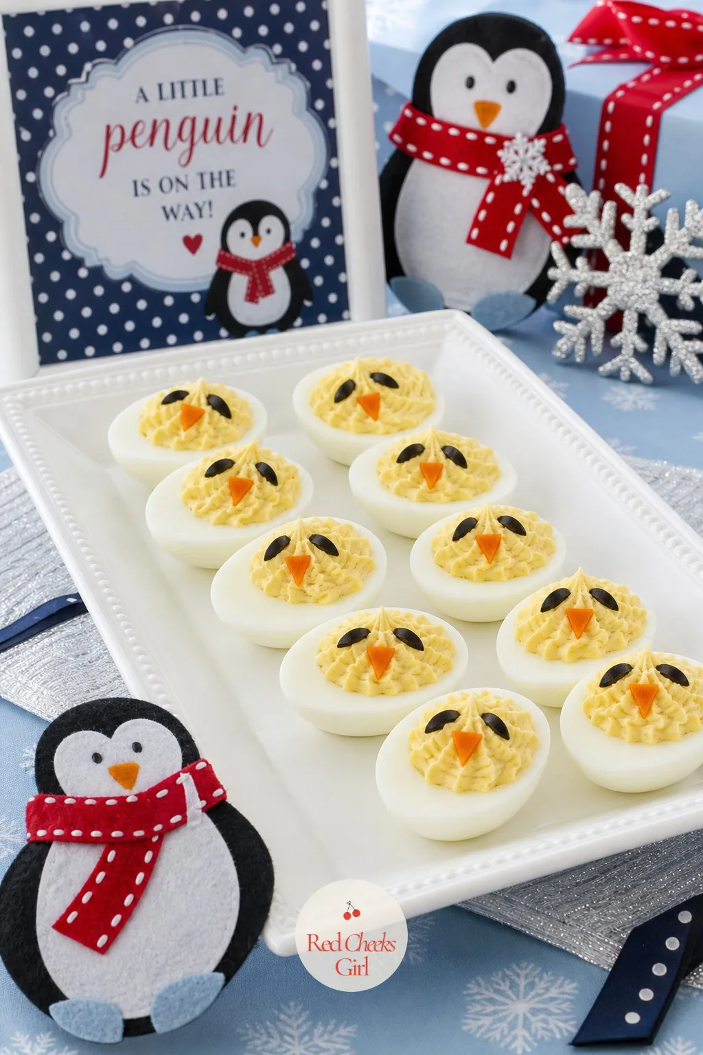 Black and White Deviled Eggs — A familiar party food dressed for the theme takes almost no extra effort. Penguin baby shower ideas