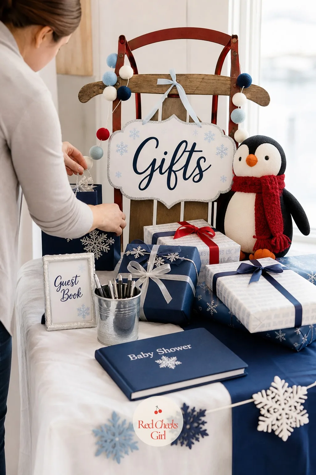 Gift Table With Sled Display — Gifts pile up fast, and a table left to its own devices looks like an afterthought by the second hour. Penguin baby shower ideas