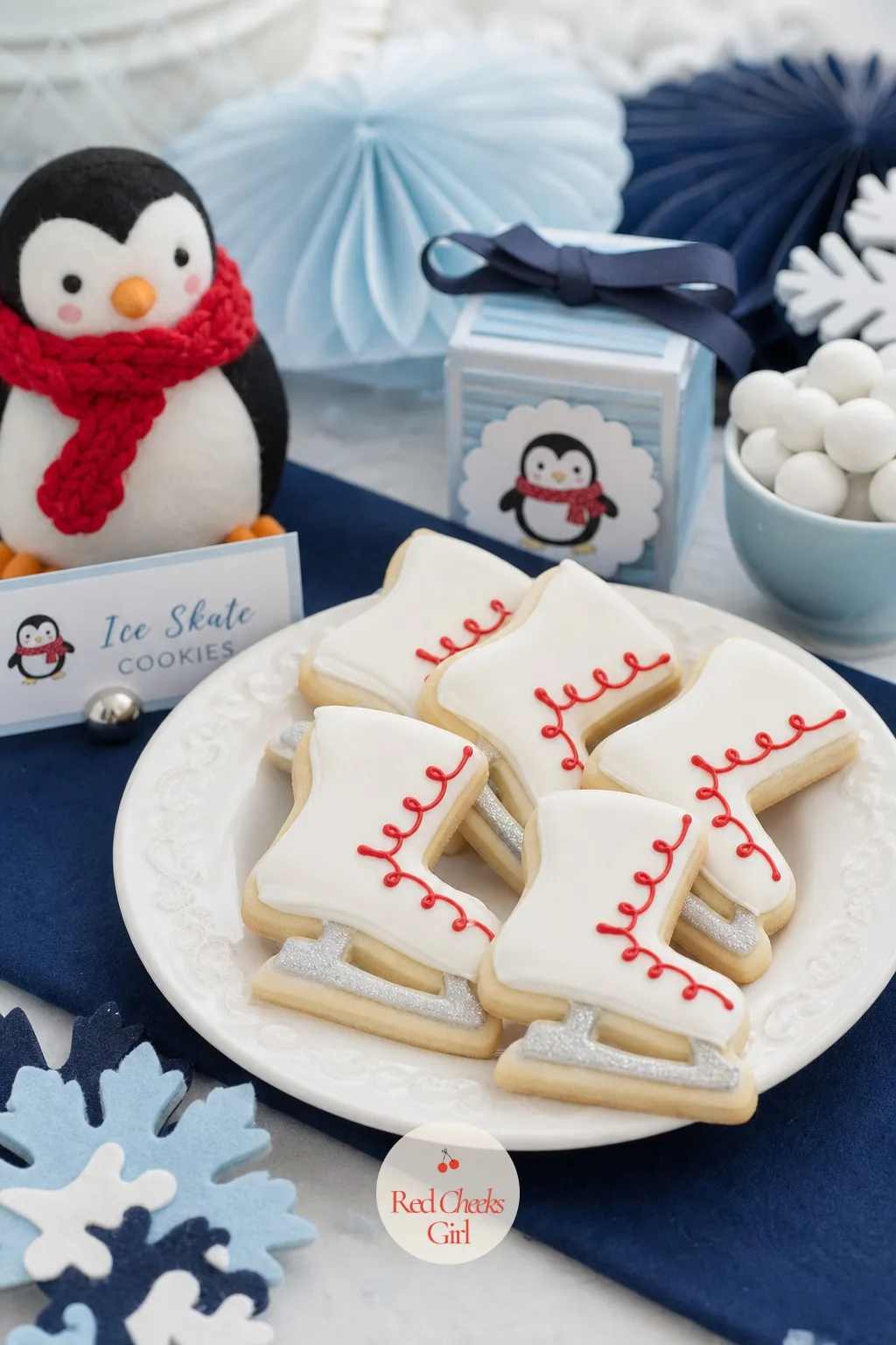 Ice Skate Shortbread Cookies — One shape across the whole dessert table gets boring fast, and this one breaks it up. Penguin baby shower ideas