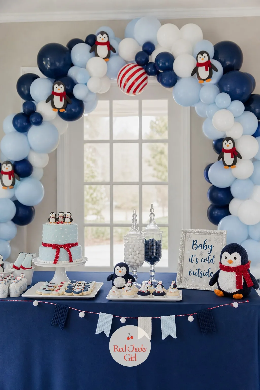 Navy and Ice-Blue Penguin Balloon Arch — An arch over the dessert table reads far more expensive than it actually is. Penguin baby shower ideas