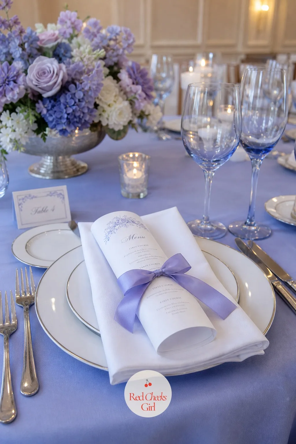 The Menus — At each place setting, a small rolled card tied with ribbon tells a guest what is coming before the first course arrives. Periwinkle wedding theme