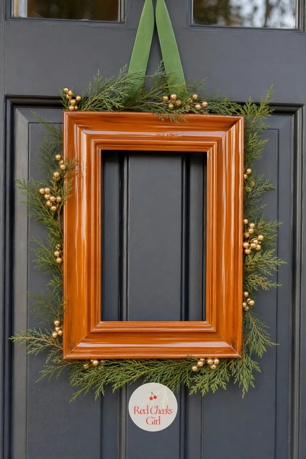 The Amber Lacquered Frame with Juniper and Gold Wax Berries — A thin coat of amber lacquer turns a dull wooden frame into something that looks lit from within.