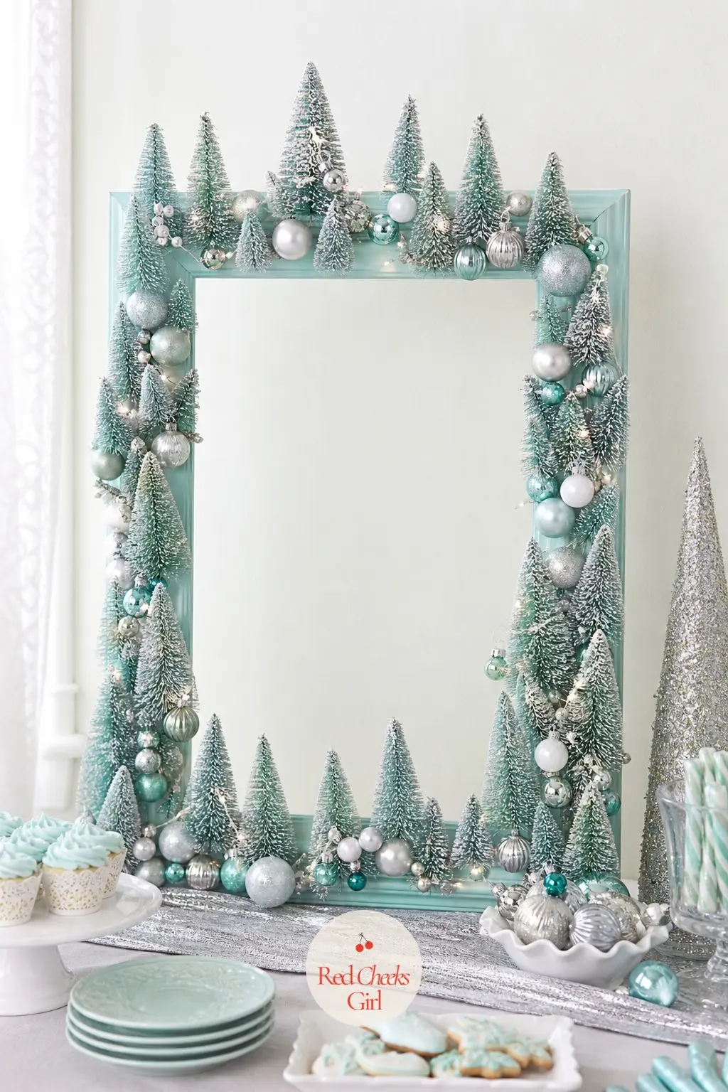 The Icy Mint Chalk-Paint Frame with Silver-Tipped Bottlebrush Trees — Mint is not a colour most holiday decor touches, which is exactly why it works for one