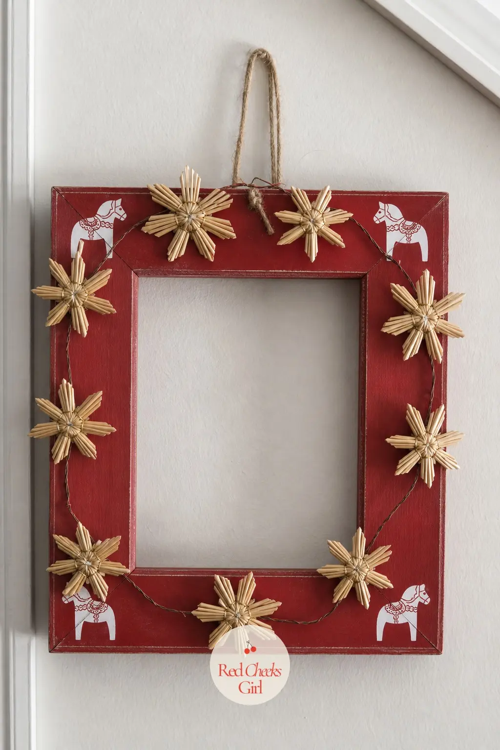 The Scandinavian Folk Frame with Painted Horses and Straw Stars — A barn red base coat and a simple white folk horse silhouette stencilled into each corner