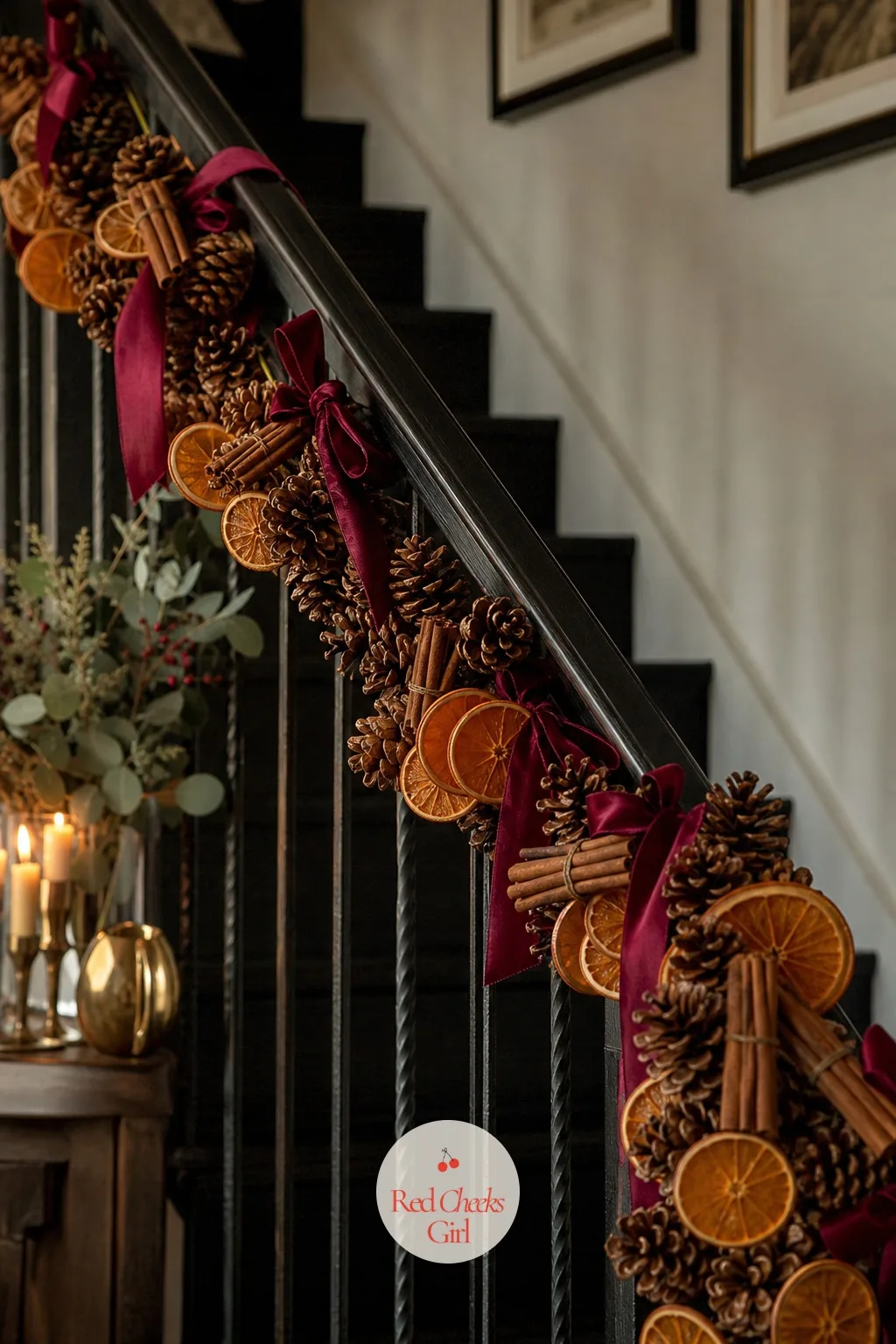 Dried Orange And Cinnamon Pinecone Swag — A swag does what a wreath cannot: it drapes, over a railing, along a mantel edge, down a staircase, wherever a full