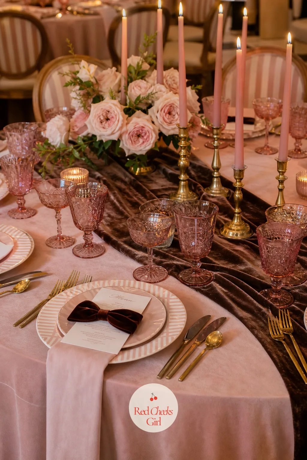 Retro Pink Glassware At Every Place Setting — Instead of plain glass, every water goblet and coupe on the table is tinted the same soft rose, the kind of
