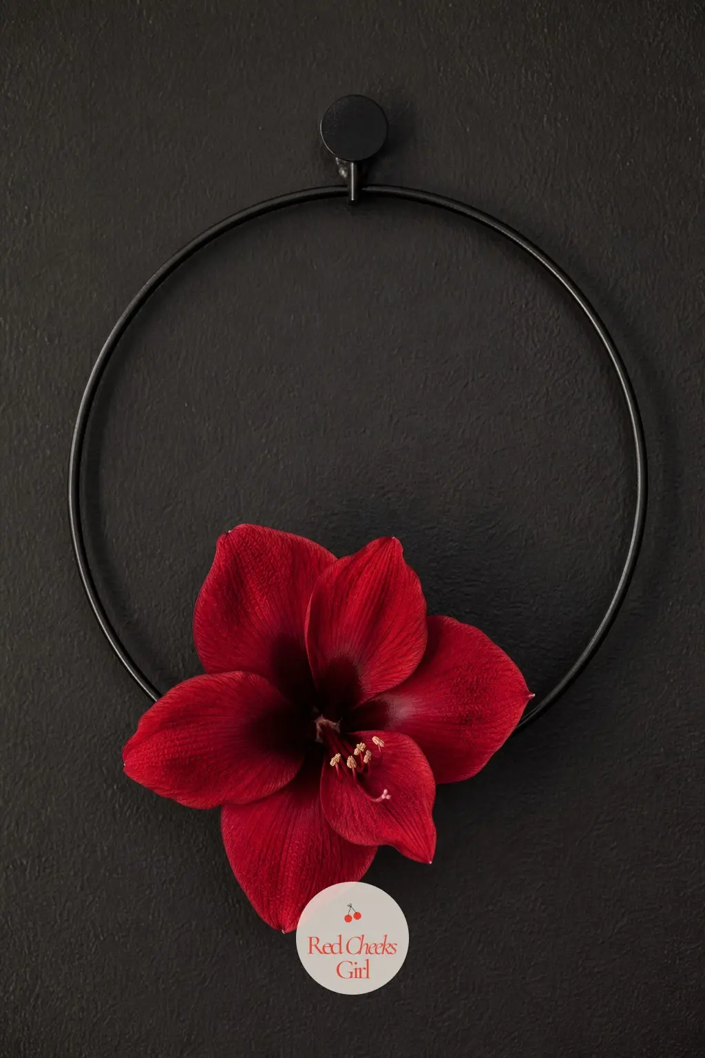 The Crimson Amaryllis and Black Iron Wreath for the Home Speakeasy Bar — A deep crimson faux amaryllis, the tall trumpet bloom rather than a small flower, sits