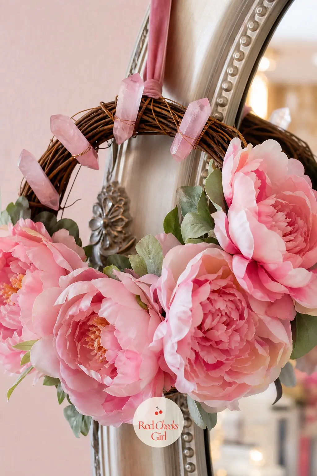 The Rose Quartz Point and Pink Silk Peony Wreath for the Vanity Mirror — Raw rose quartz points sit between open pink silk peonies on a slim grapevine ring