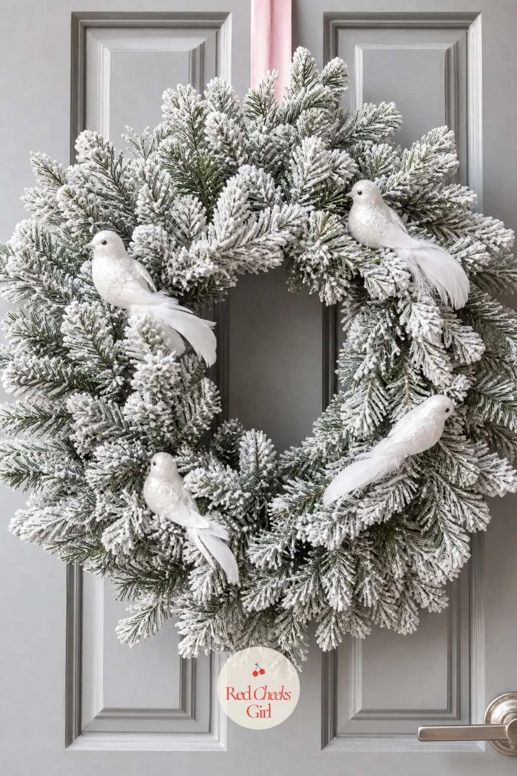 The White Flocked Fir and Dove Ornament Wreath for the Home Office Door — A dense white flocked fir base carries three or four small white dove ornaments