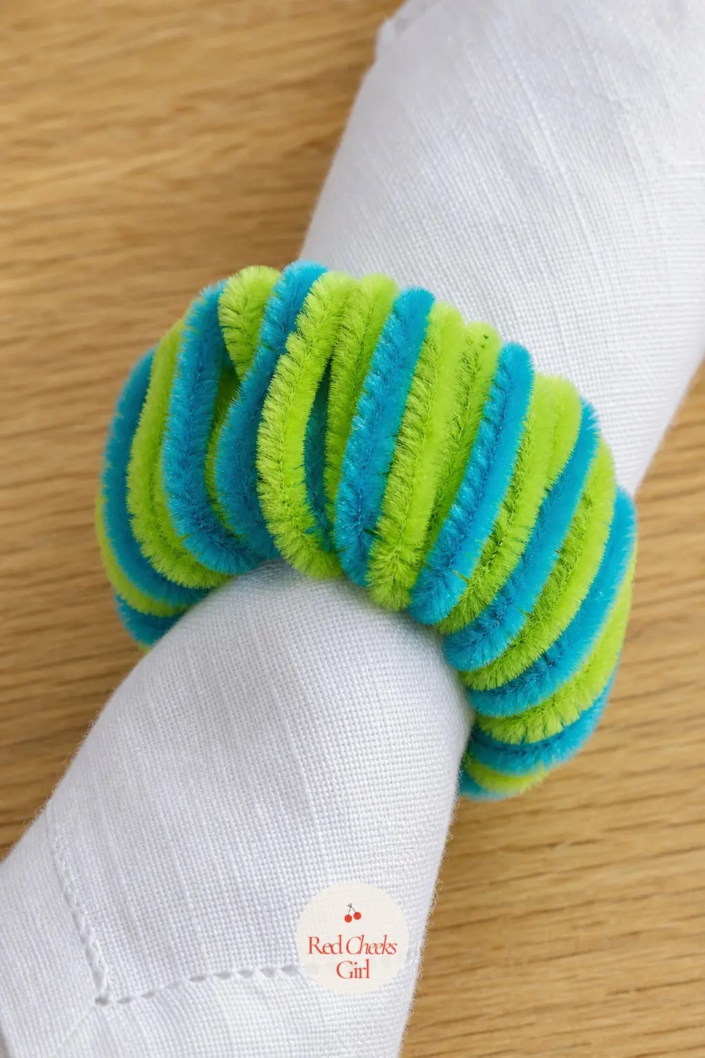The Lime and Turquoise Coil Napkin Ring Wreath — Size this one to slip over a rolled napkin rather than hang anywhere, which makes it a genuinely new use for