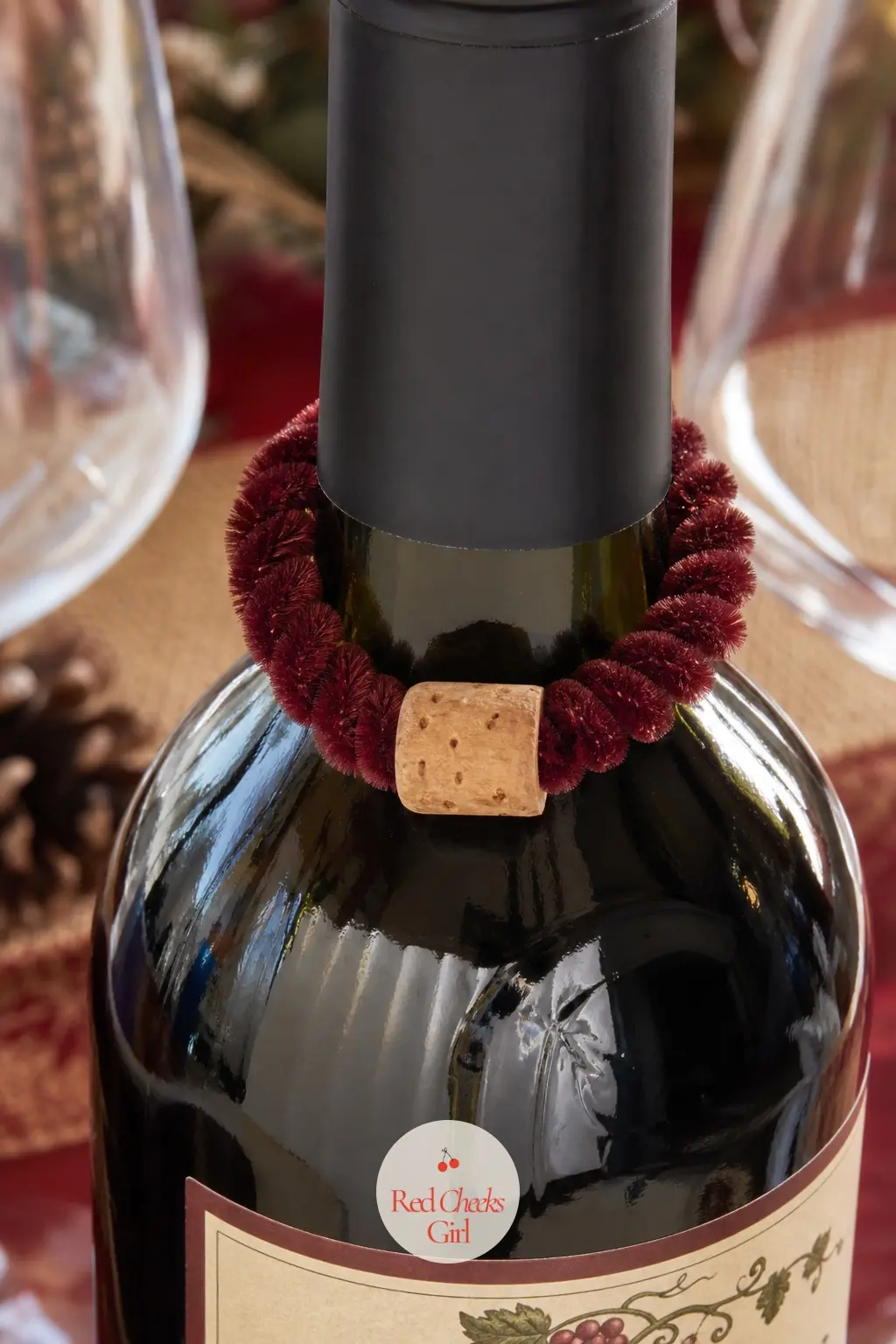 The Mini Wine Charm Wreath for the Hostess Gift Table — Size this one to slip over the neck of a wine bottle rather than hang anywhere, using a single burgundy