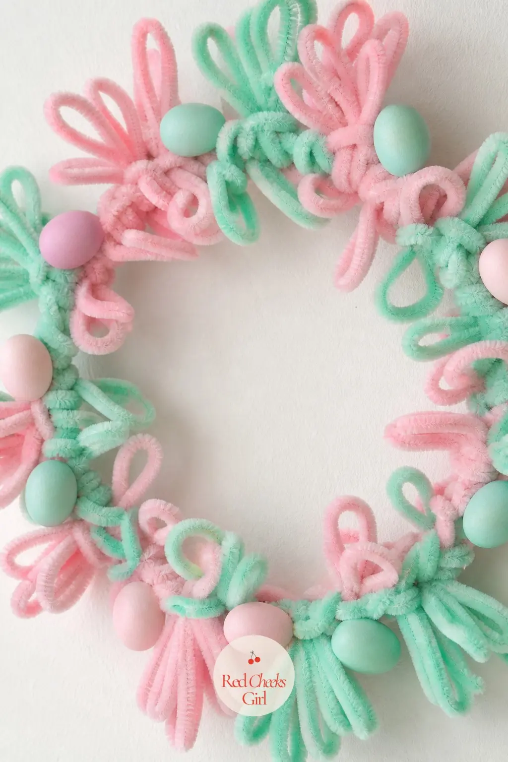 The Pastel Pink and Mint Egg Wreath for the Easter Brunch — Pastel pink and soft mint pipe cleaners coil around a small frame, then a handful of pastel