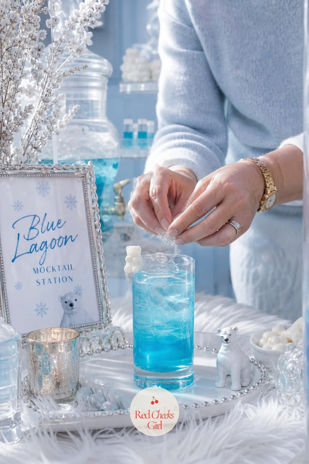 Blue Lagoon Mocktail Station — Blue curacao syrup, the alcohol-free kind sold specifically for mocktails, stirred into lemon-lime soda over ice turns a clear