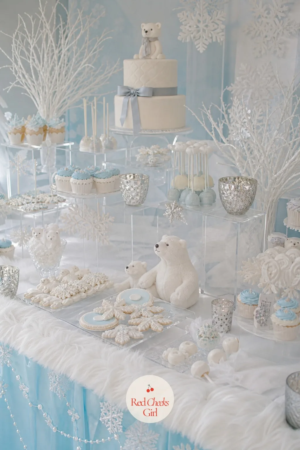 Dessert Table Styled as an Ice Shelf — White and clear acrylic risers of different heights turn a flat table into a shelf of ice, each level holding one