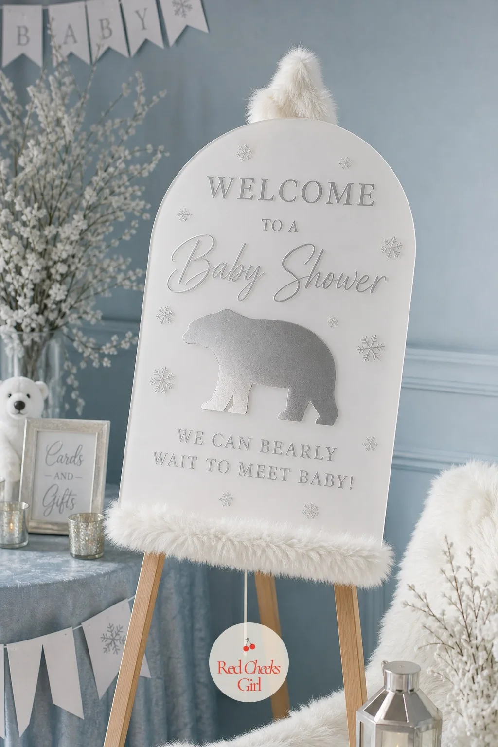 Icy Arch Welcome Sign on an Easel — Guests stop here before anything else, so it earns the biggest single spend of the day. Polar bear baby shower theme
