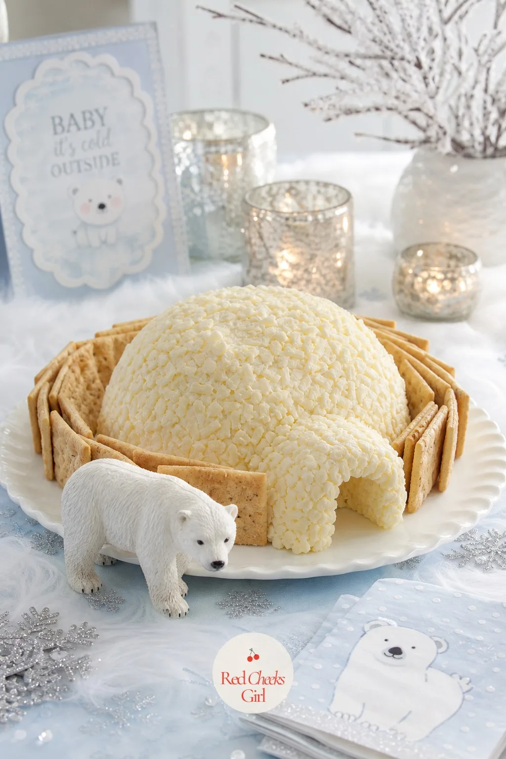 Igloo Cheese Ball Platter — A cheese ball rolled in shredded white cheddar instead of the usual chopped nuts, pressed into a rough dome shape and ringed with a