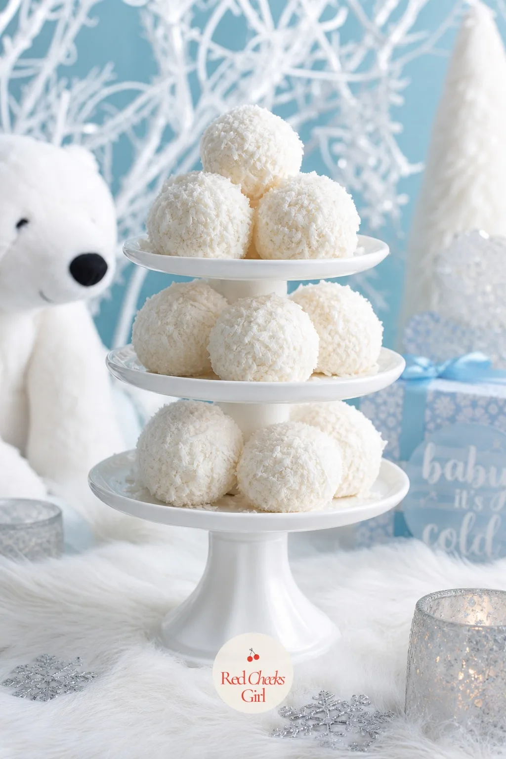 Snowball Cupcakes Rolled in Coconut — A second cupcake flavour, chocolate this time, frosted and rolled whole in shredded white coconut so it comes out looking