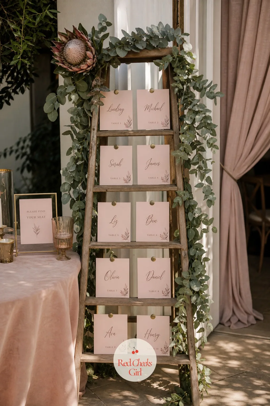 An Escort Card Display Built Around Protea — Just inside the reception, guests search out their table number from a display built like a small garden rather