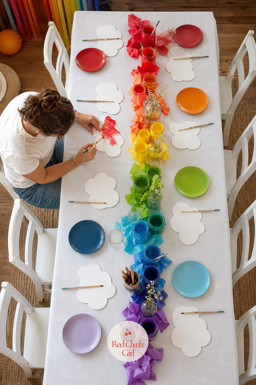 A Paint Your Own Cloud Craft Table — A party with nothing for small hands to do turns restless fast, usually right when the cake still needs cutting. Rainbow