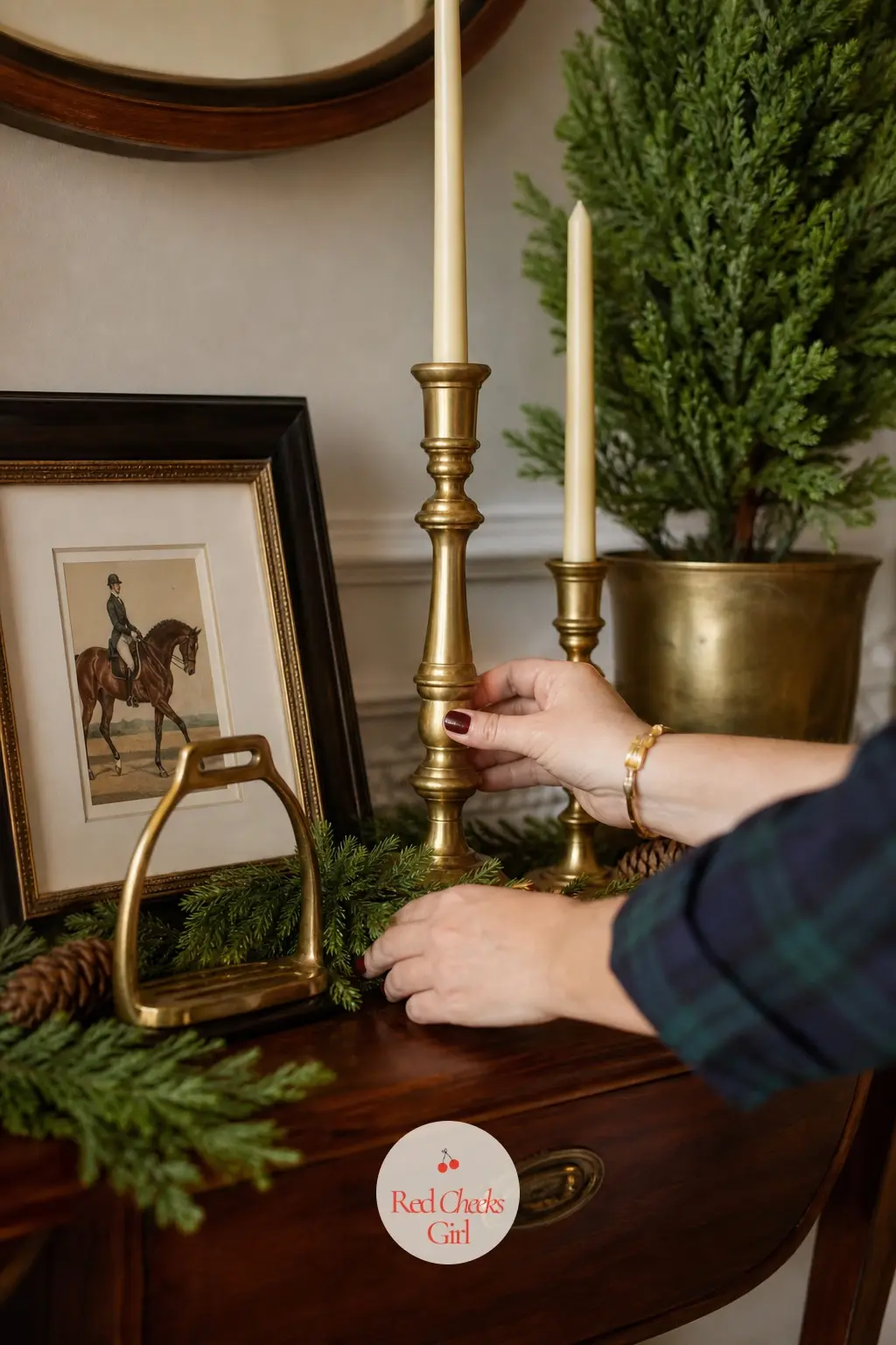 A Console Styled Like A Family Heirloom — A small framed equestrian print leans against the wall above the console, a brass stirrup sits as an object rather