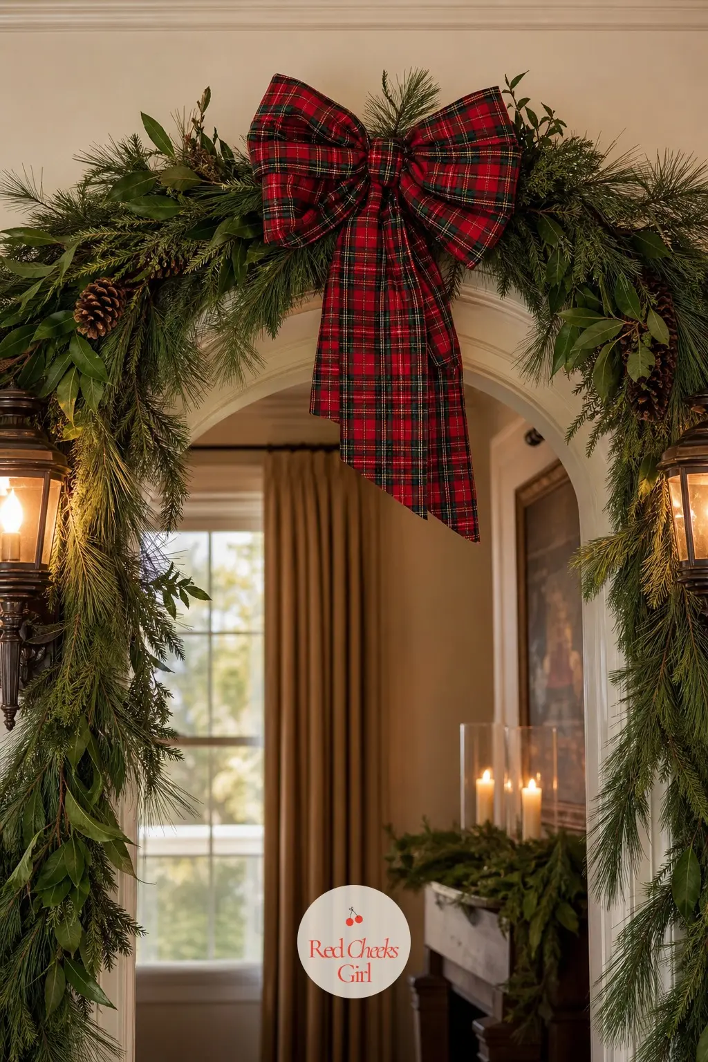 A Garland Over The Archway Between Rooms — A pine garland swags loosely over the arch between the hall and the dining room, anchored at the center with one