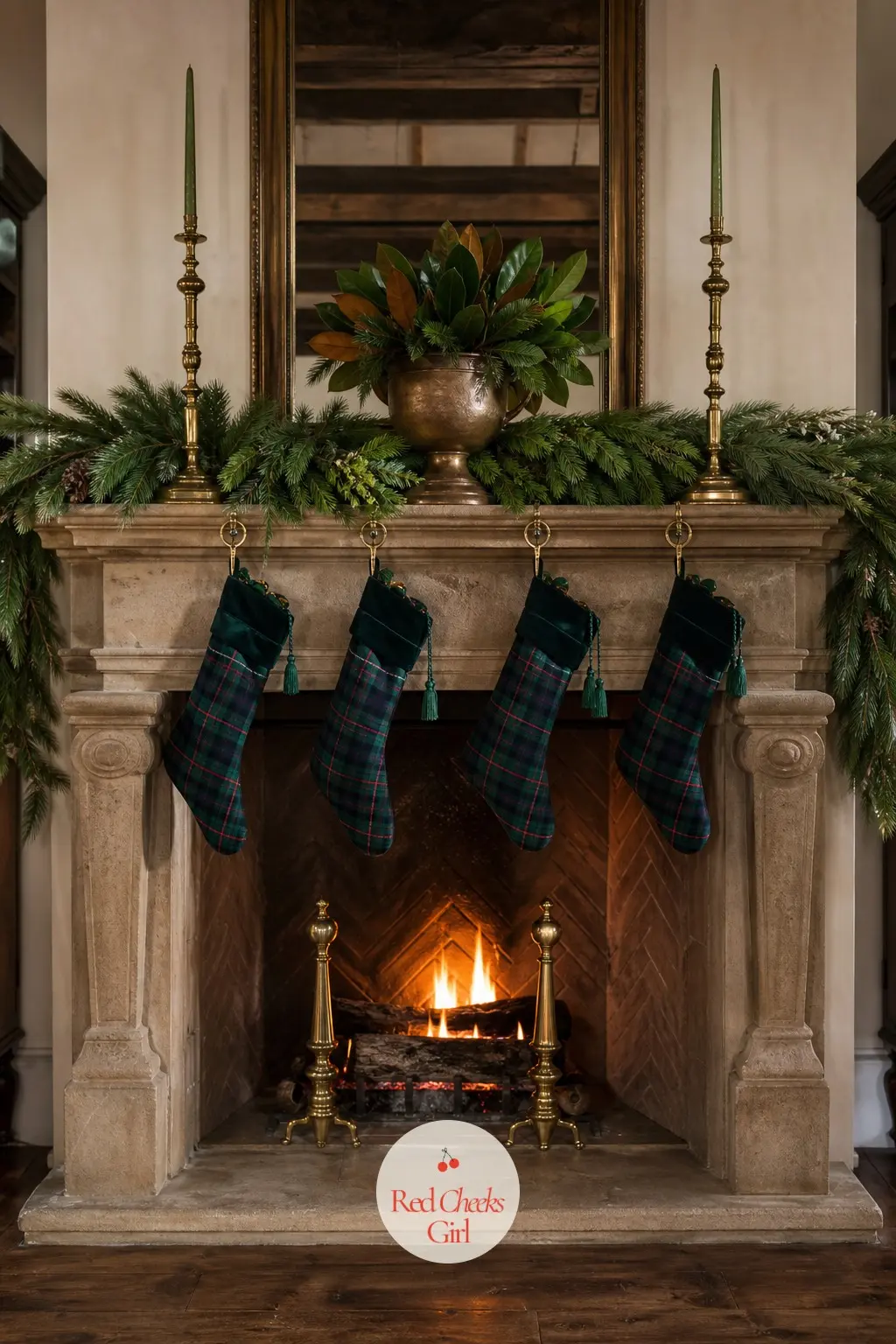 A Mantel Dressed In Greenery And Brass Candlesticks — Fresh garland lies flat along the mantel shelf, a pair of tall brass candlesticks stand at either end